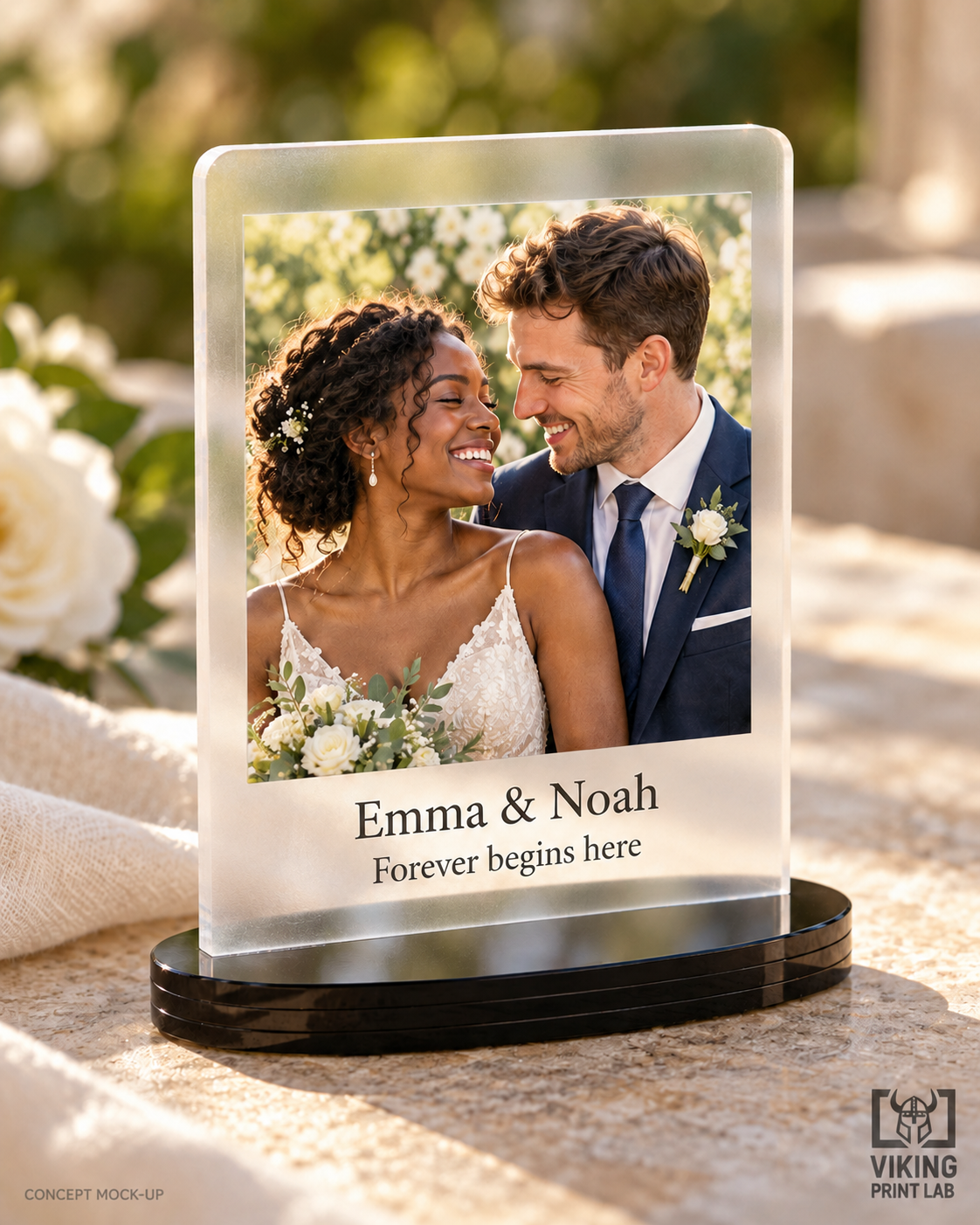 Everheld frosted acrylic wedding photo keepsake with Emma and Noah personalization and black oval stand.