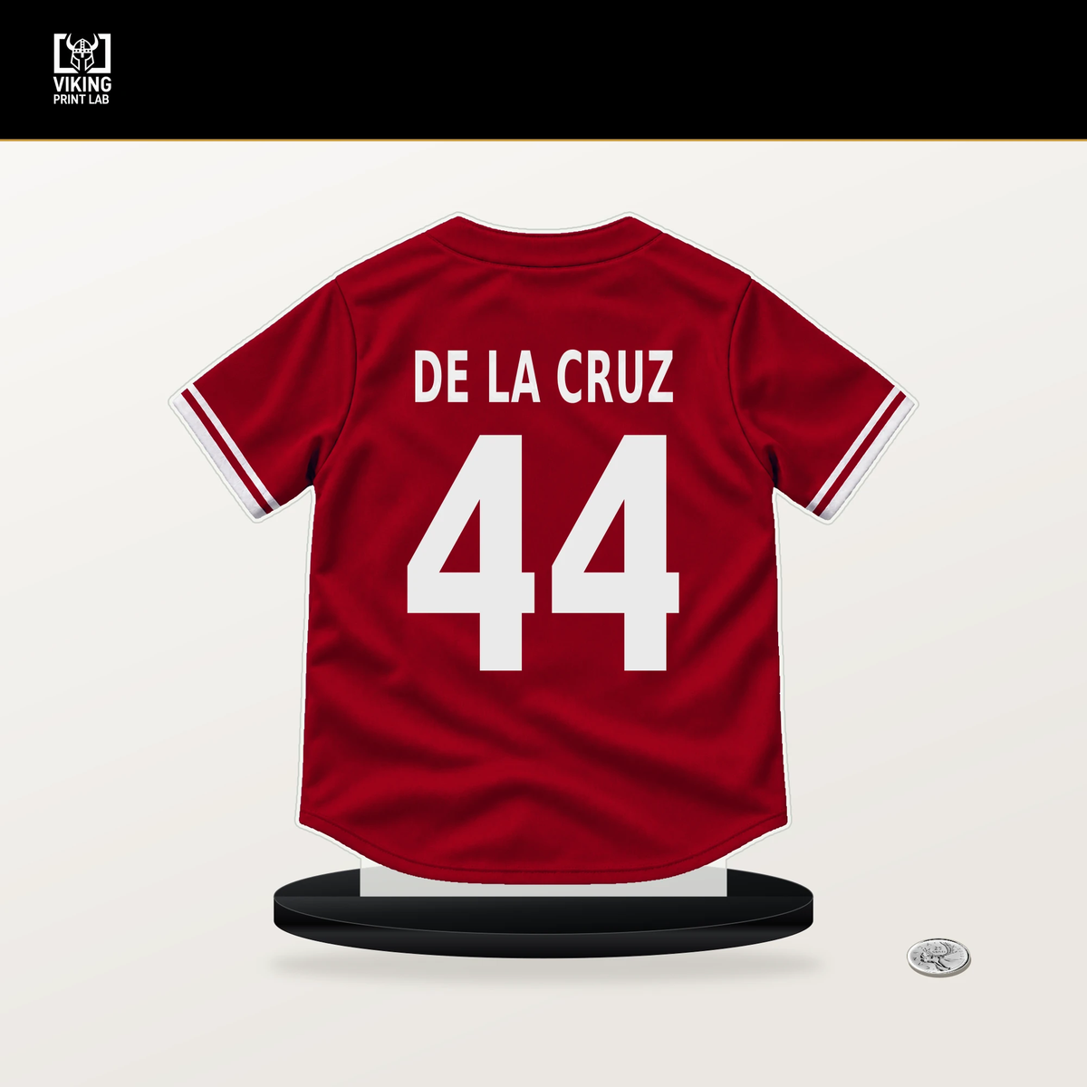 Elly De La Cruz number 44 Cincinnati Reds jersey stand with included black base.
