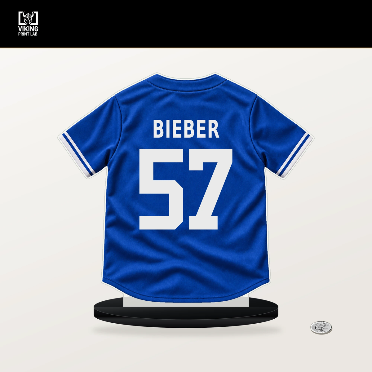 Shane Bieber number 57 Toronto Blue Jays jersey stand with included black base.