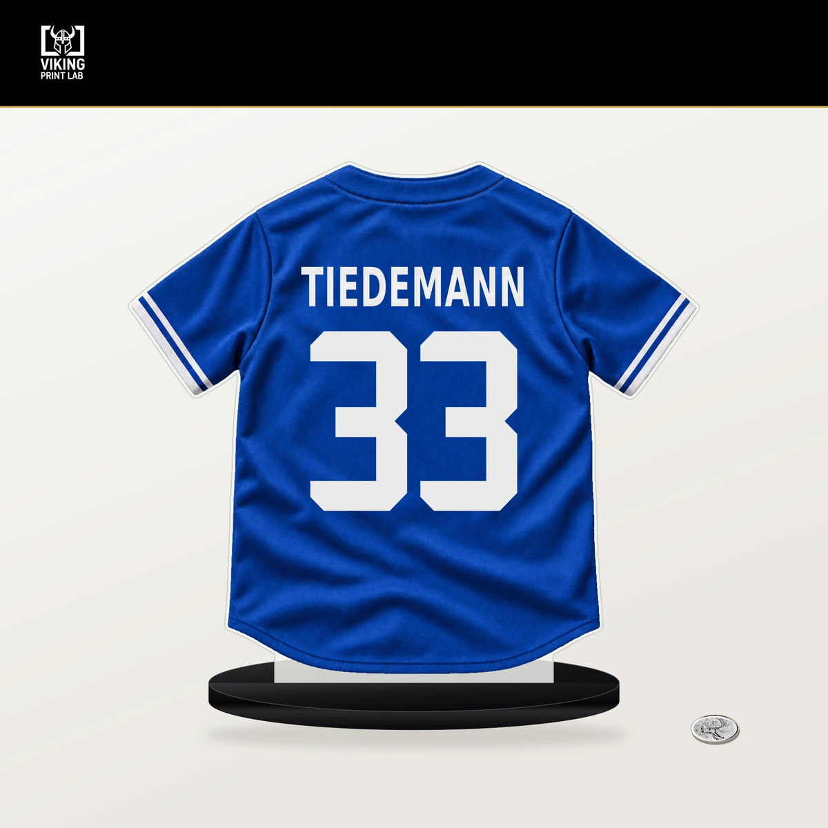 Ricky Tiedemann number 33 Toronto Blue Jays jersey stand with included black base.