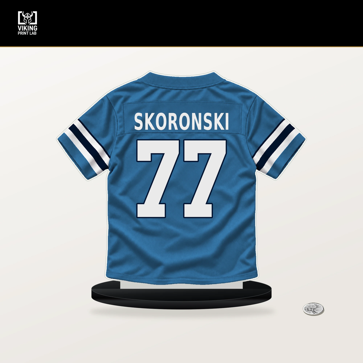 Peter Skoronski number 77 Tennessee Titans jersey stand with included black base.