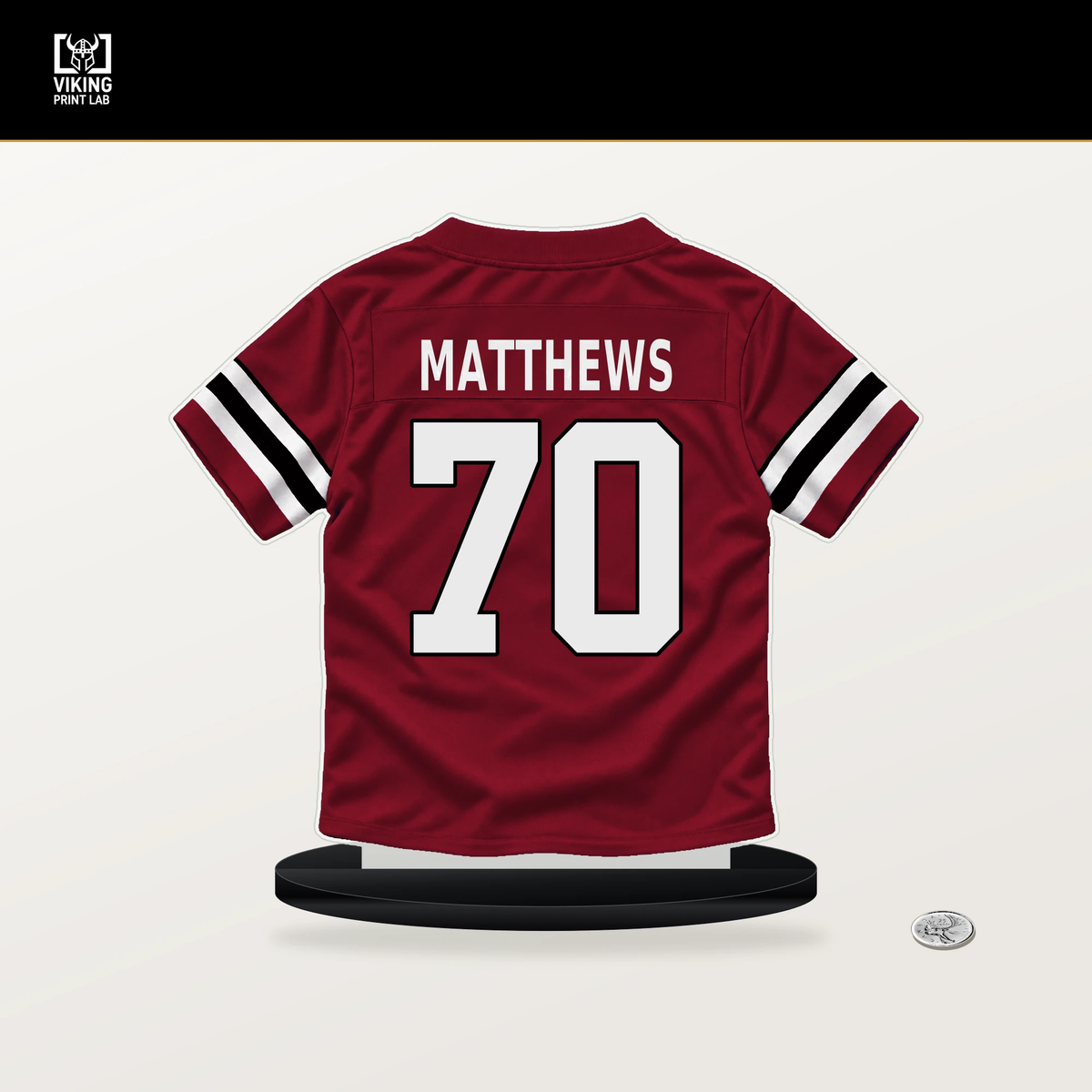 Jake Matthews number 70 Atlanta Falcons jersey stand with included black base.