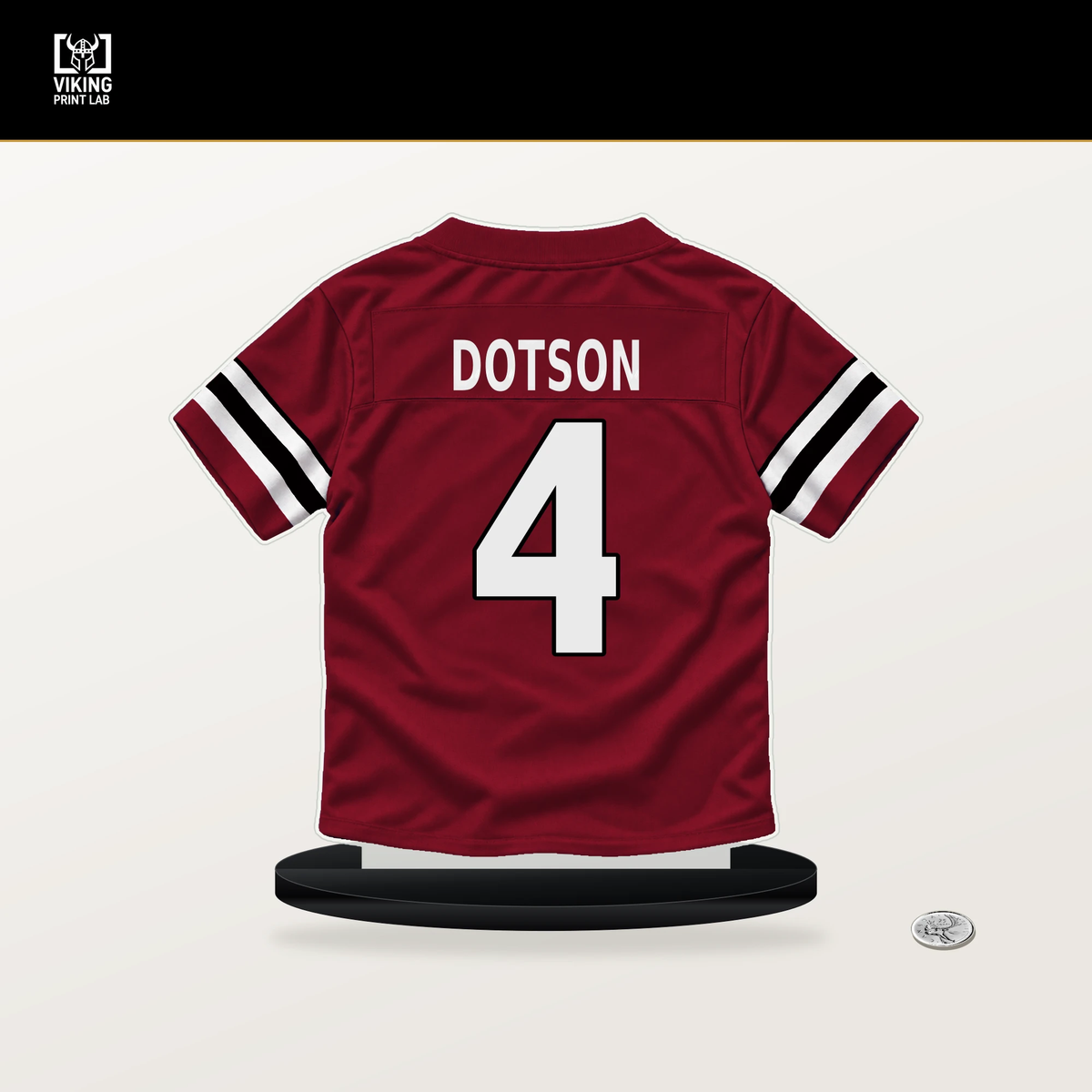 Jahan Dotson number 4 Atlanta Falcons jersey stand with included black base.