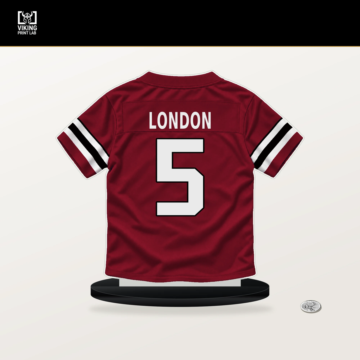Drake London number 5 Atlanta Falcons jersey stand with included black base.