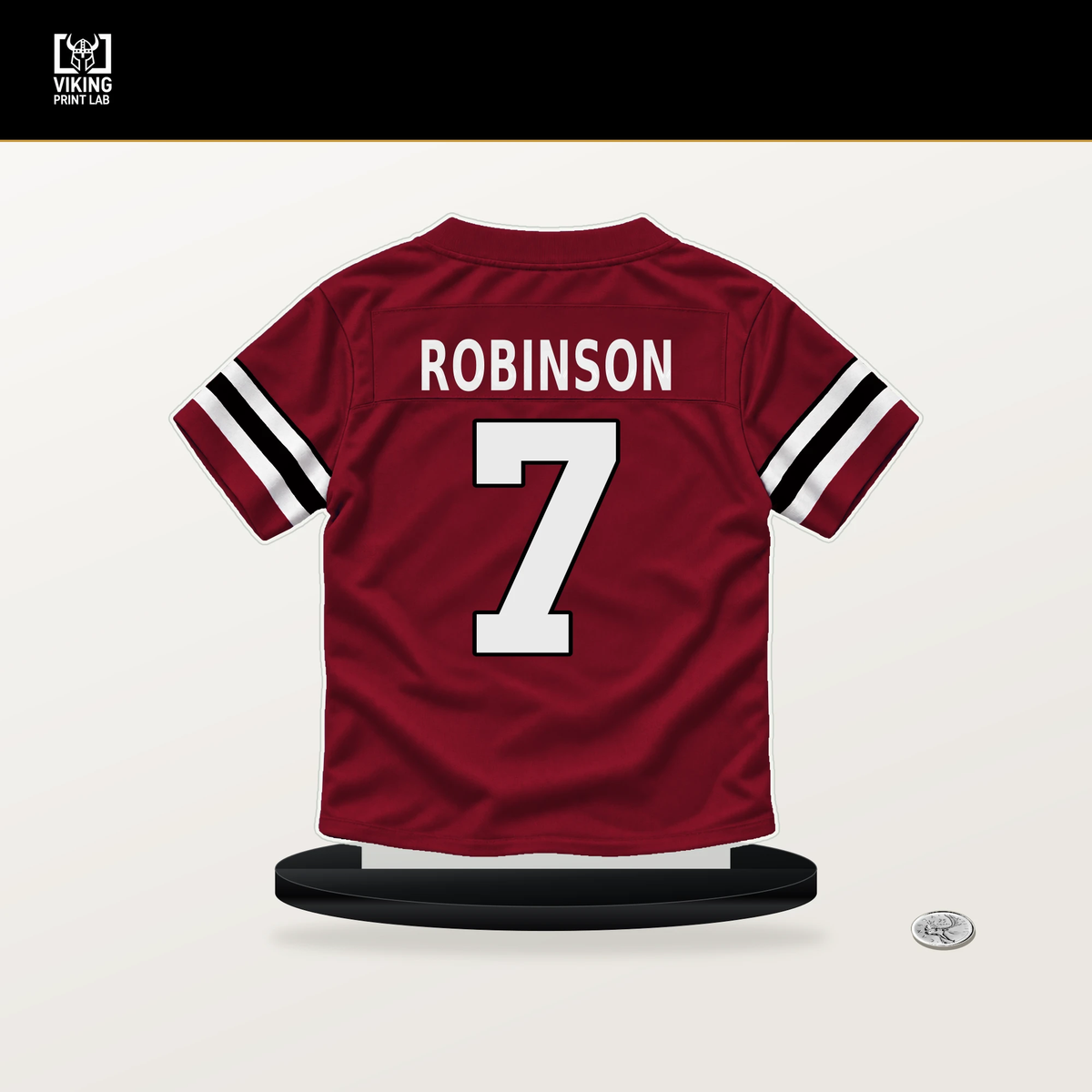 Bijan Robinson number 7 Atlanta Falcons jersey stand with included black base.