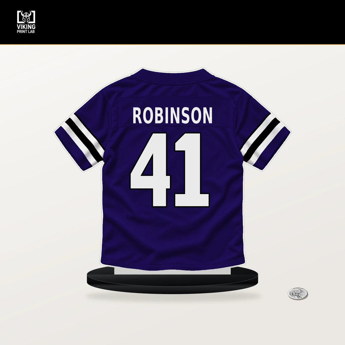 Jahquez Robinson number 41 Baltimore Ravens jersey stand with included black base.