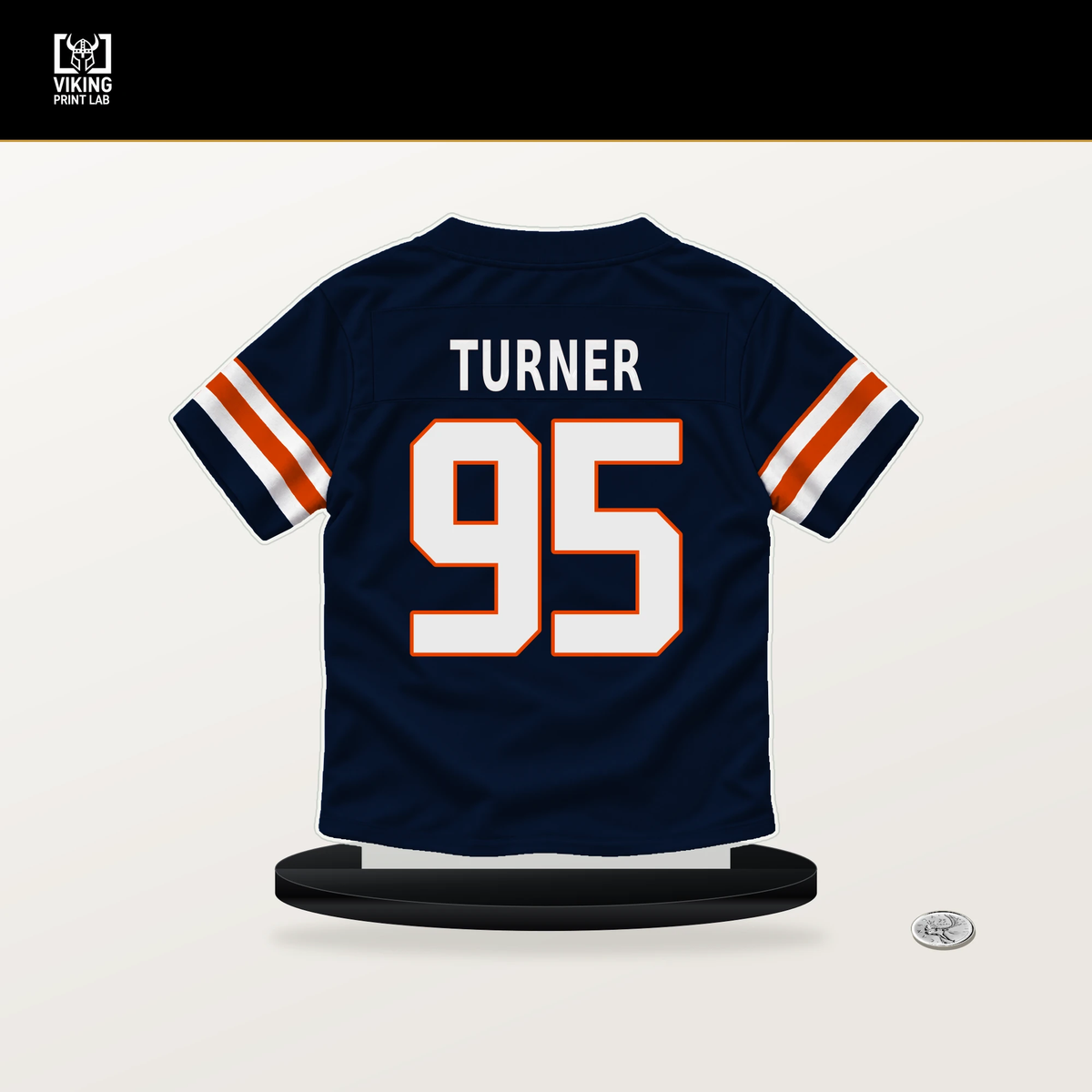 Shemar Turner number 95 Chicago Bears jersey stand with included black base.