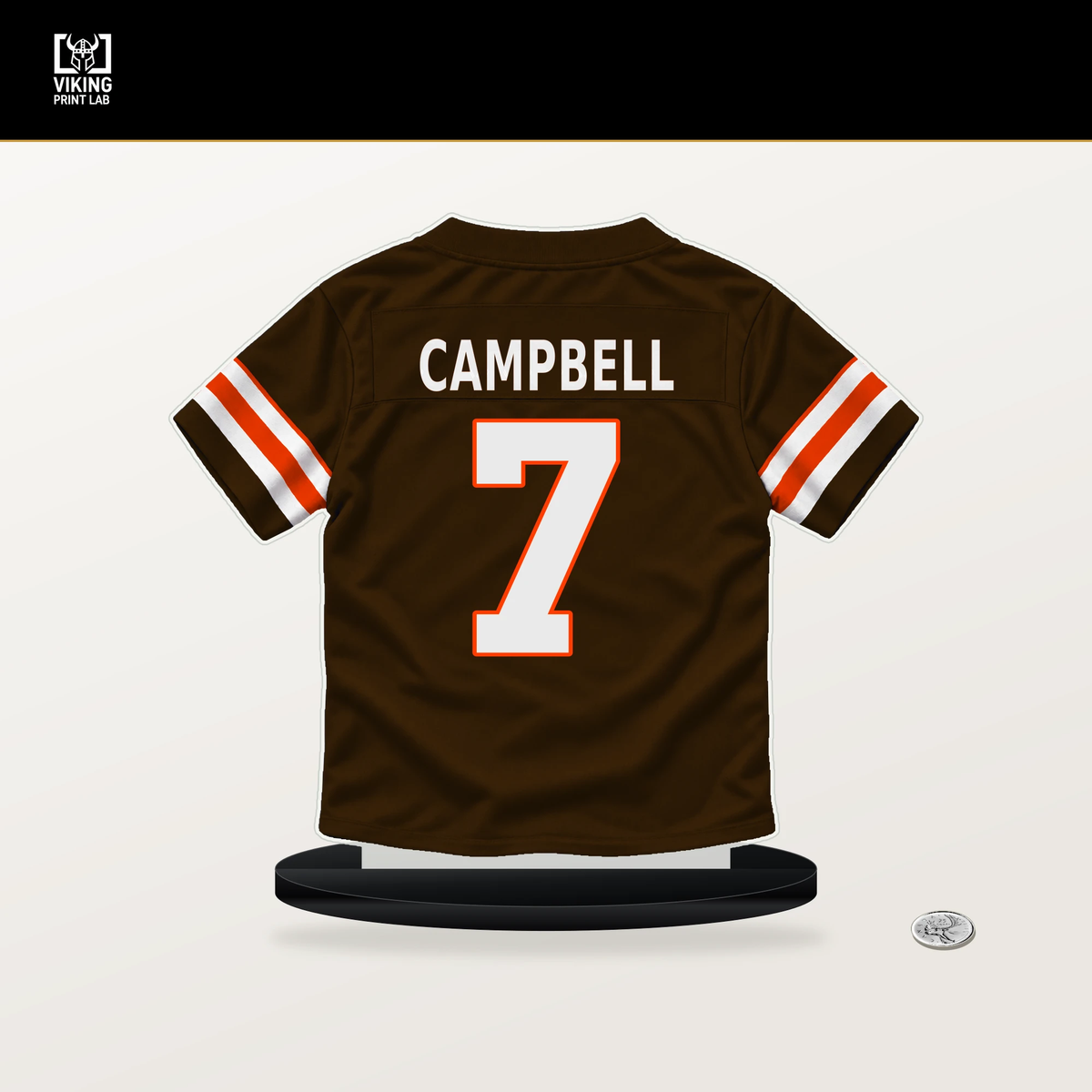 Tyson Campbell number 7 Cleveland Browns jersey stand with included black base.