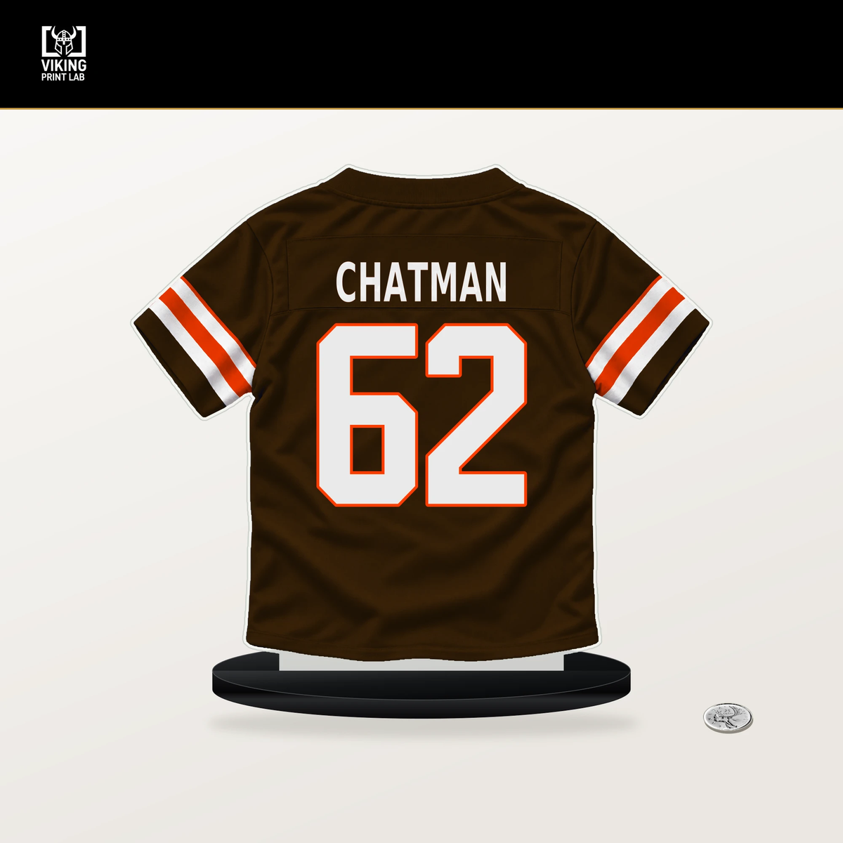 Elijah Chatman number 62 Cleveland Browns jersey stand with included black base.