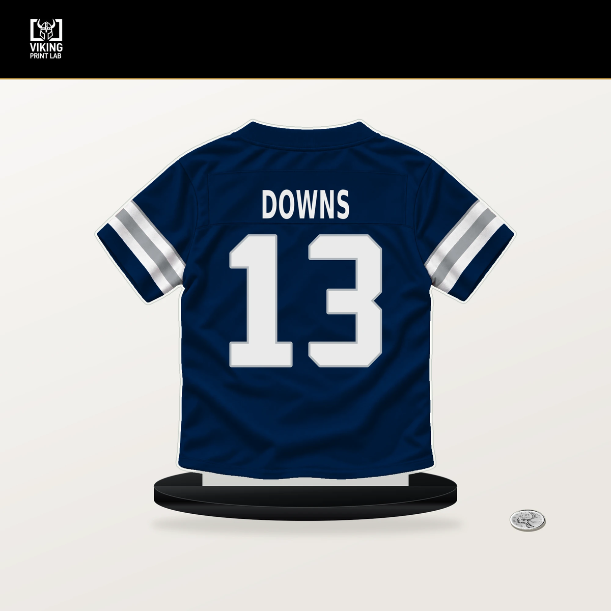 Caleb Downs number 13 Dallas Cowboys jersey stand with included black base.