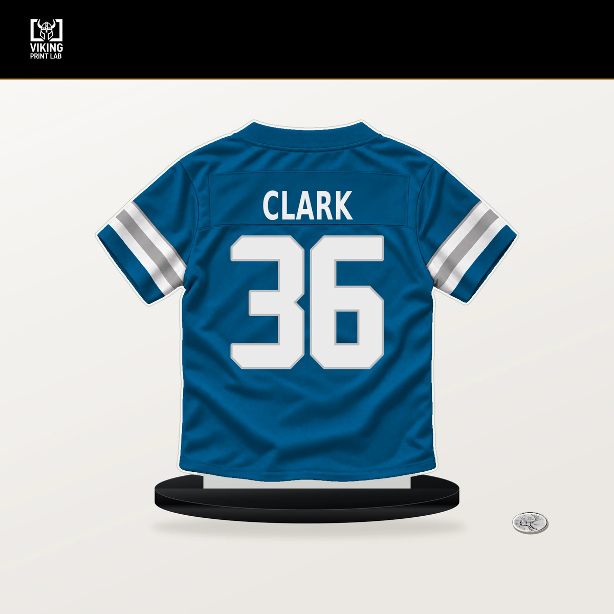 Chuck Clark number 36 Detroit Lions jersey stand with included black base.
