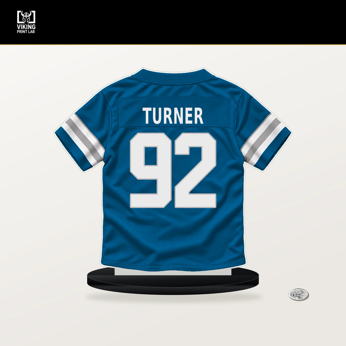 Payton Turner number 92 Detroit Lions jersey stand with included black base.