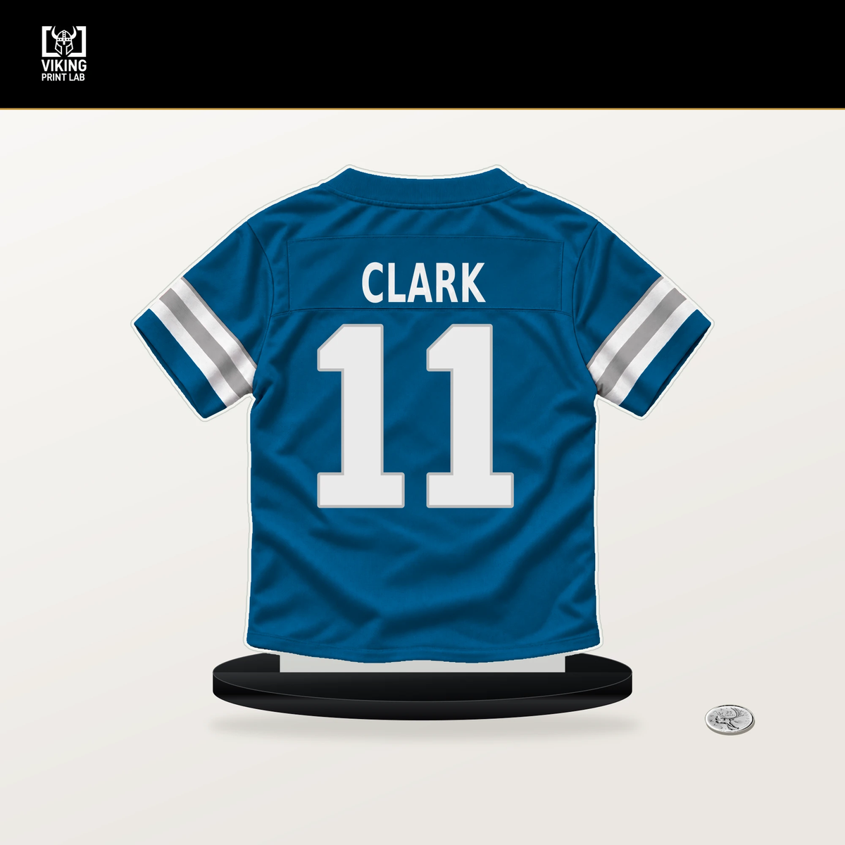 Damone Clark number 11 Detroit Lions jersey stand with included black base.