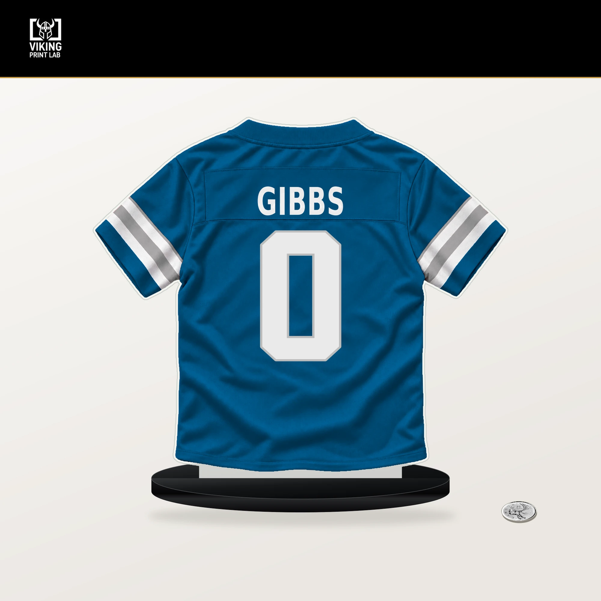 Jahmyr Gibbs number 0 Detroit Lions jersey stand with included black base.