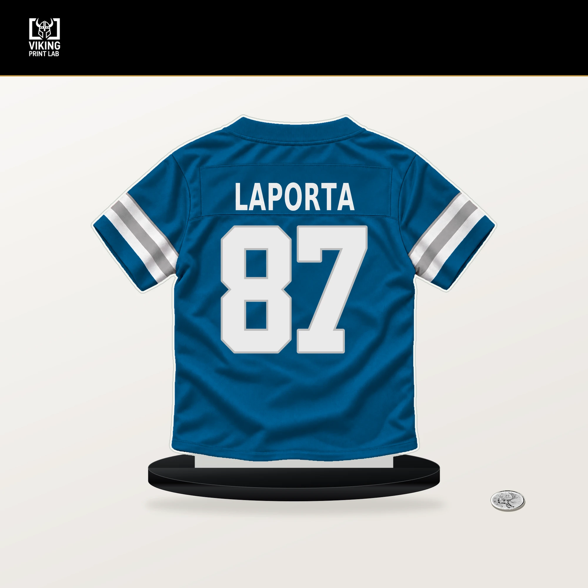 Sam LaPorta number 87 Detroit Lions jersey stand with included black base.