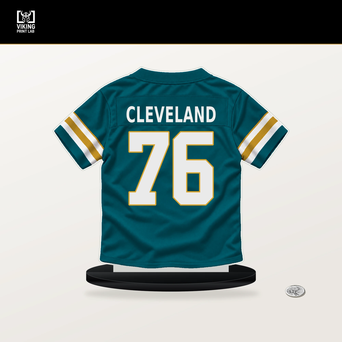 Ezra Cleveland number 76 Jacksonville Jaguars jersey stand with included black base.