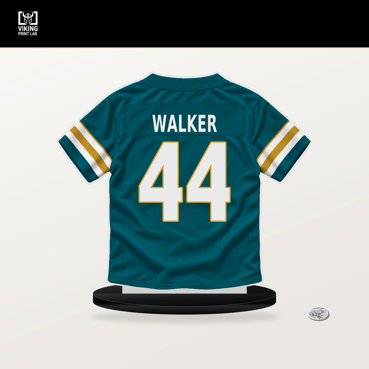Travon Walker number 44 Jacksonville Jaguars jersey stand with included black base.