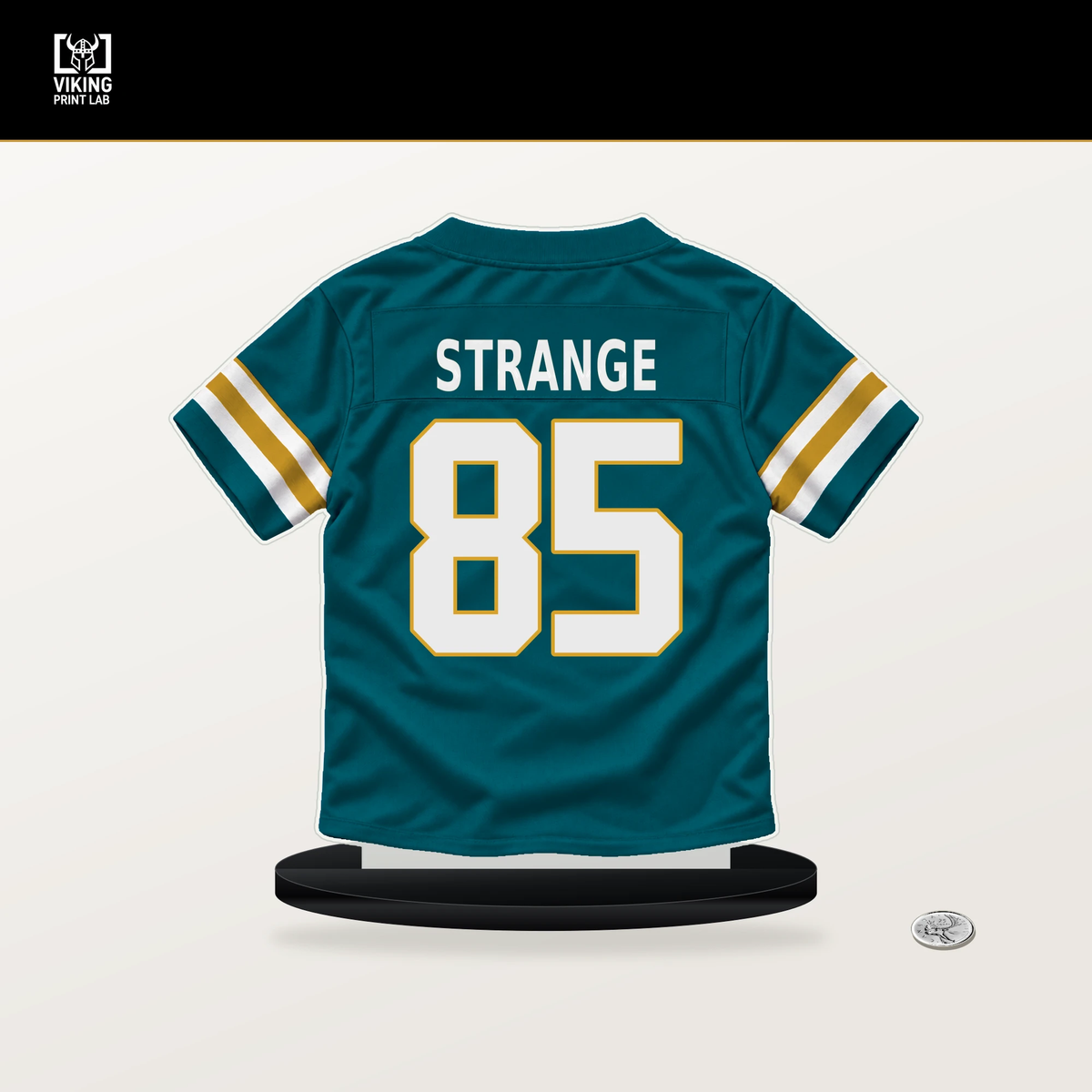 Brenton Strange number 85 Jacksonville Jaguars jersey stand with included black base.