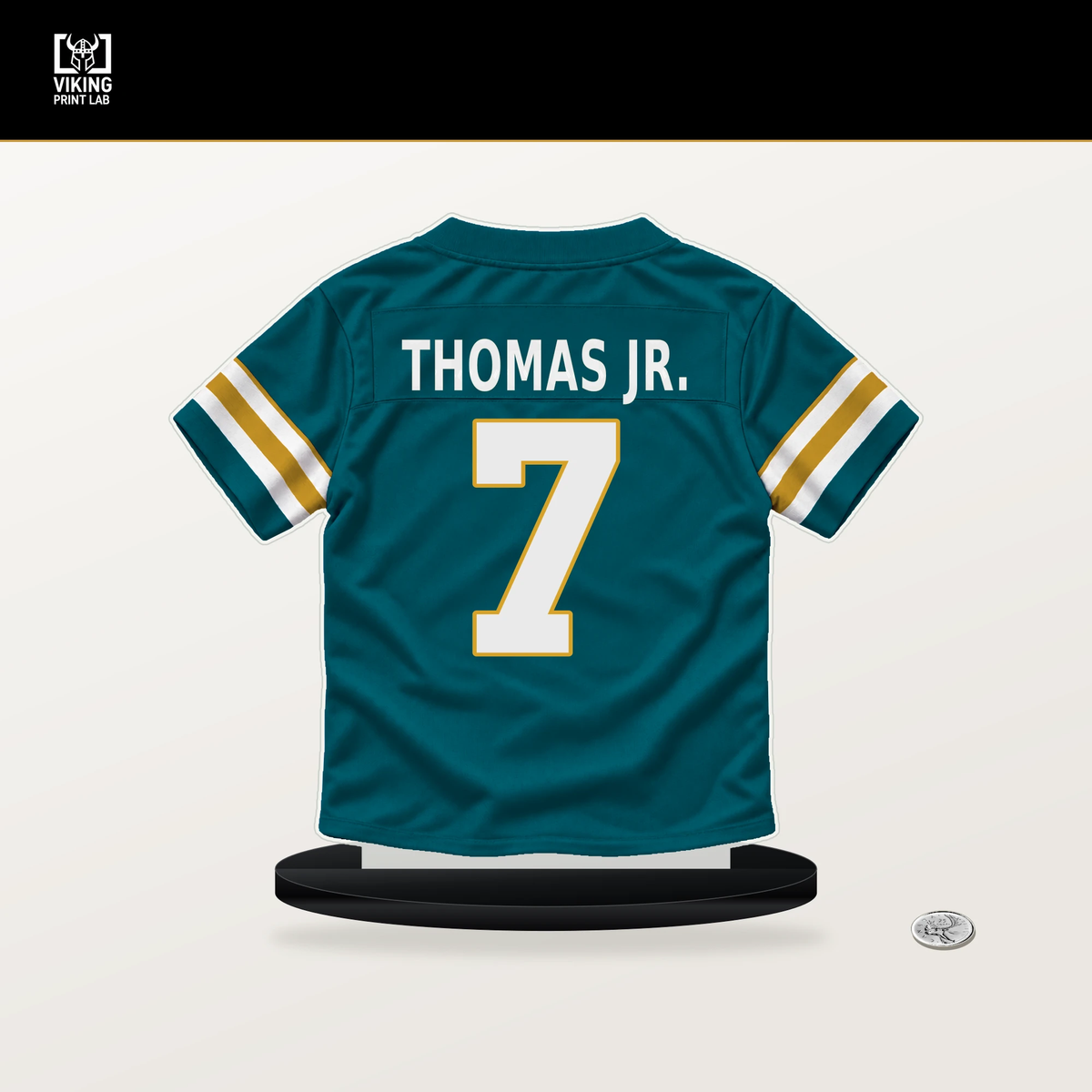 Brian Thomas Jr. number 7 Jacksonville Jaguars jersey stand with included black base.