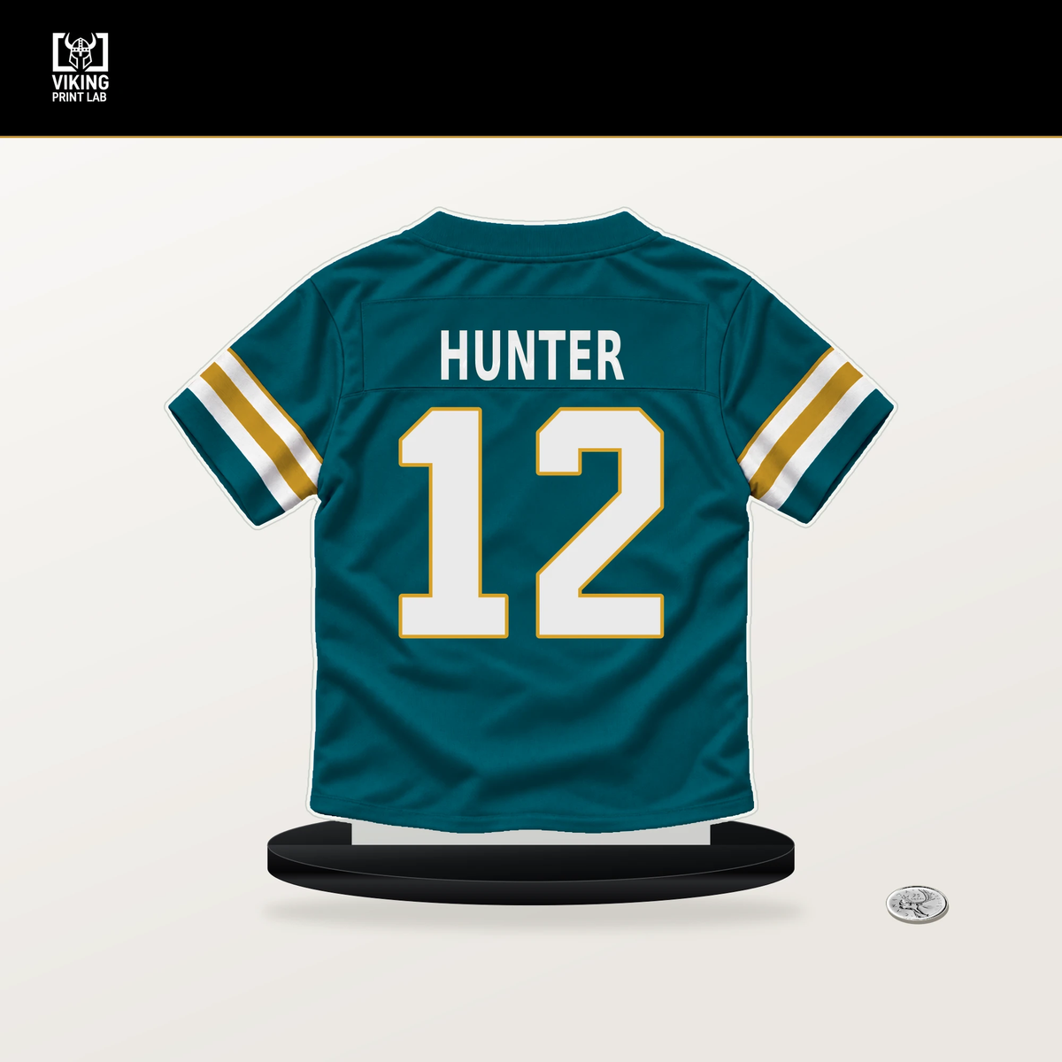 Travis Hunter number 12 Jacksonville Jaguars jersey stand with included black base.