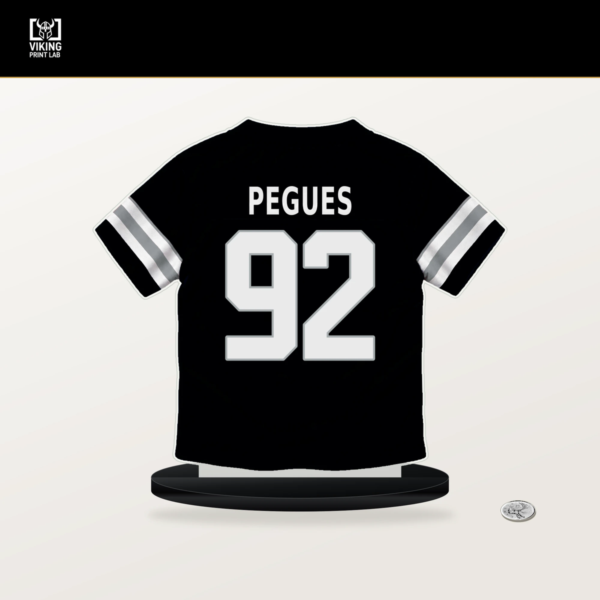 JJ Pegues number 92 Las Vegas Raiders jersey stand with included black base.