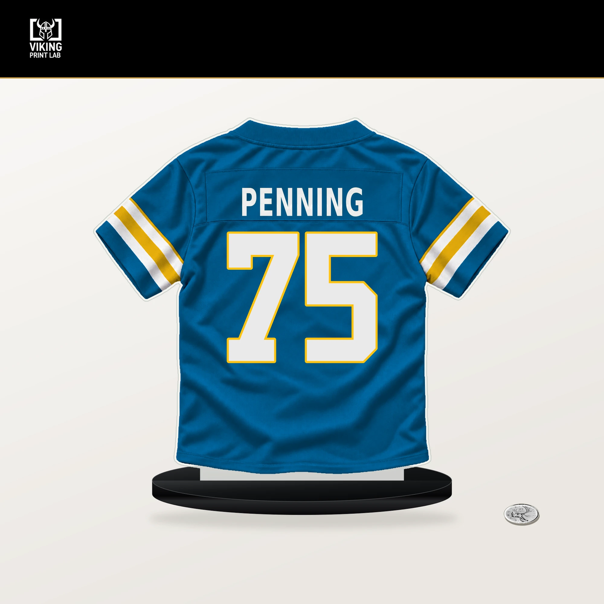 Trevor Penning number 75 Los Angeles Chargers jersey stand with included black base.