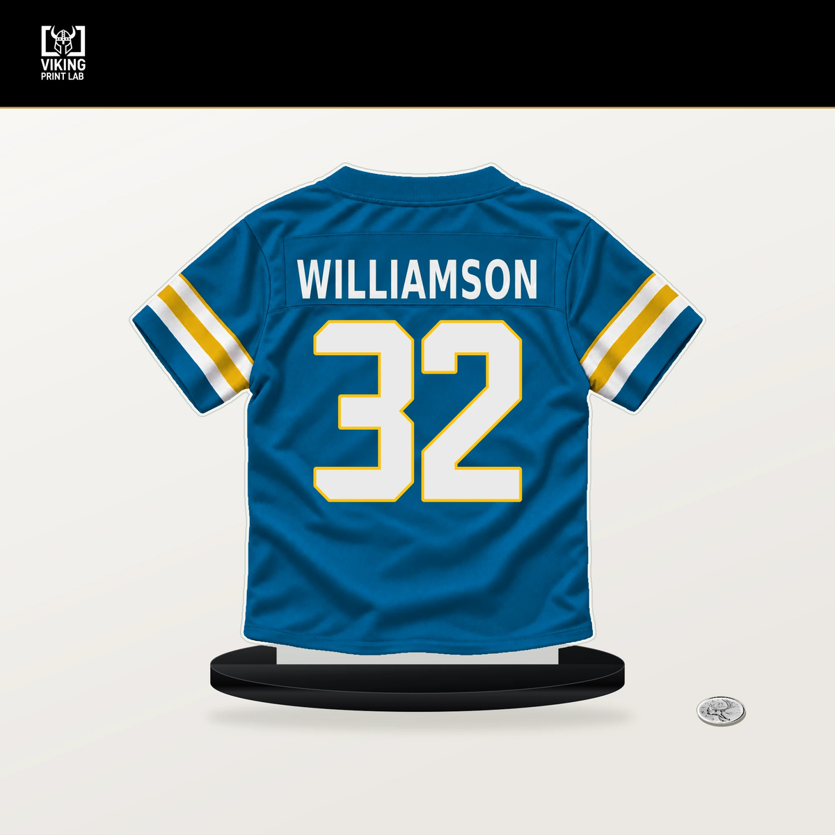 Kendall Williamson number 32 Los Angeles Chargers jersey stand with included black base.