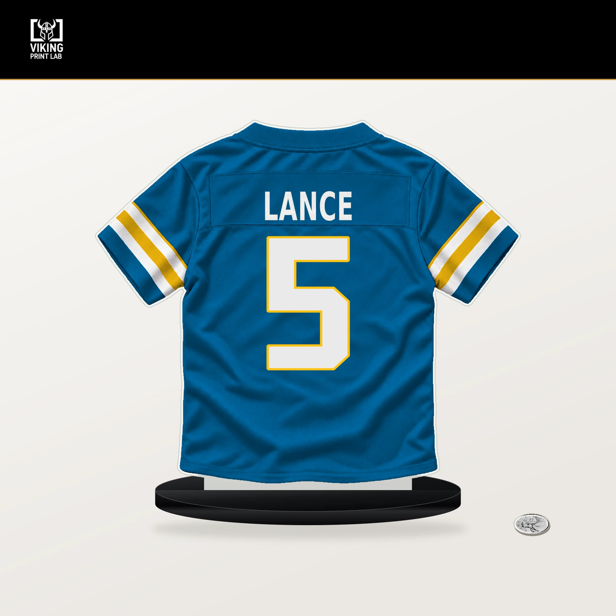 Trey Lance number 5 Los Angeles Chargers jersey stand with included black base.