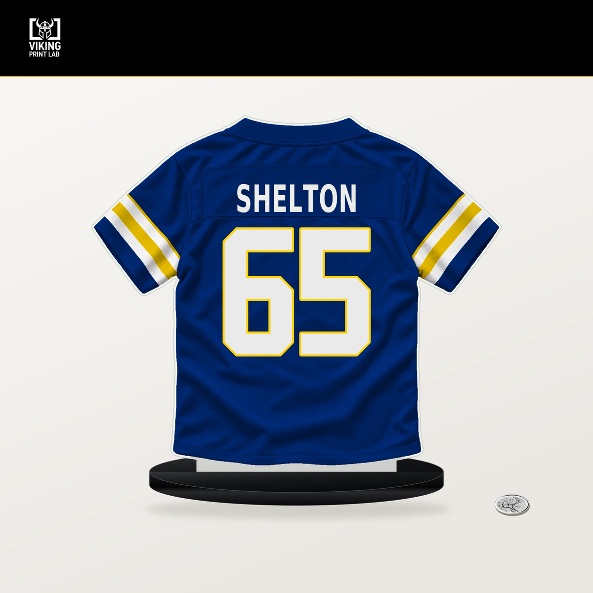 Coleman Shelton number 65 Los Angeles Rams jersey stand with included black base.