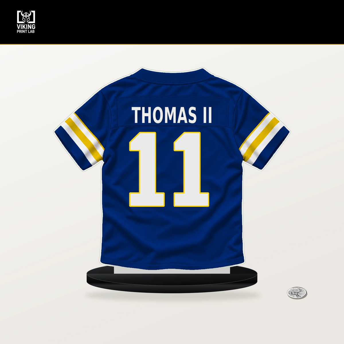Keir Thomas II number 11 Los Angeles Rams jersey stand with included black base.