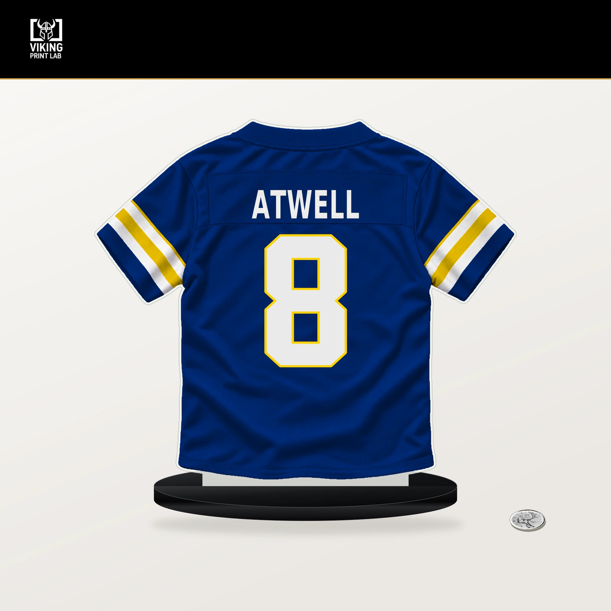 Tutu Atwell number 8 Los Angeles Rams jersey stand with included black base.