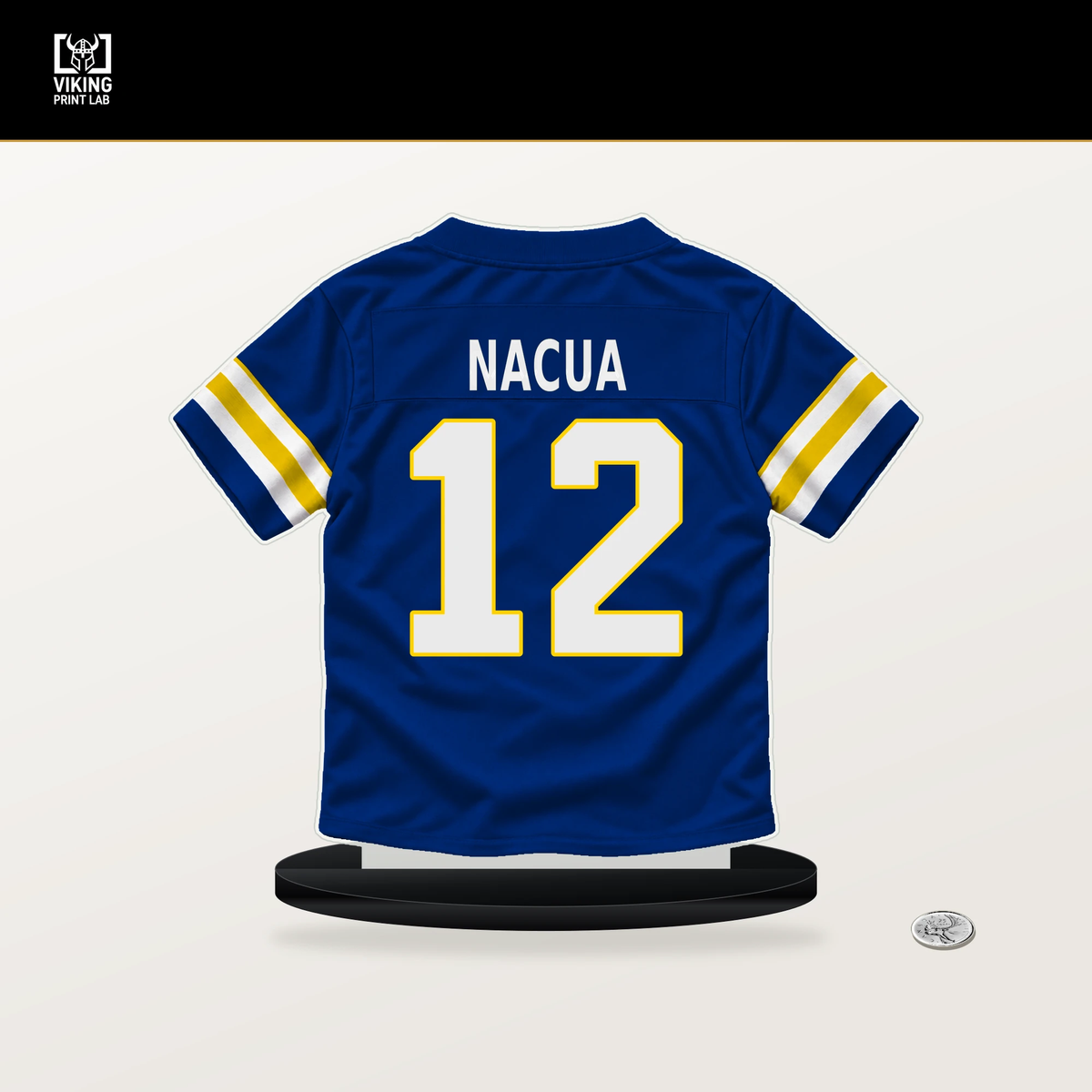 Puka Nacua number 12 Los Angeles Rams jersey stand with included black base.