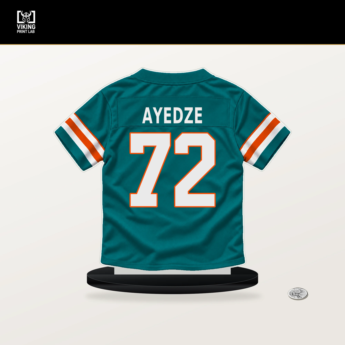 Gottlieb Ayedze number 72 Miami Dolphins jersey stand with included black base.
