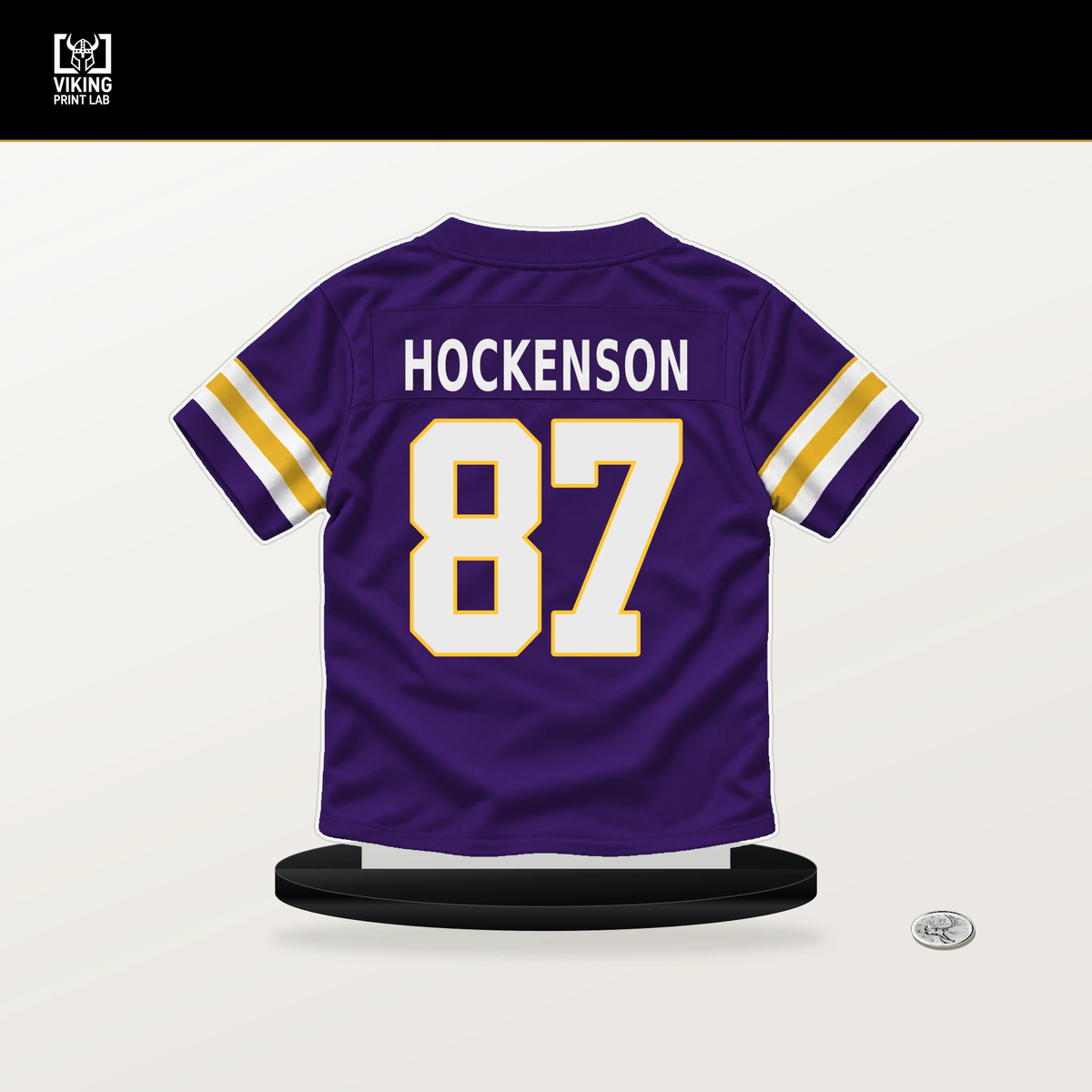 T.J. Hockenson number 87 Minnesota Vikings jersey stand with included black base.