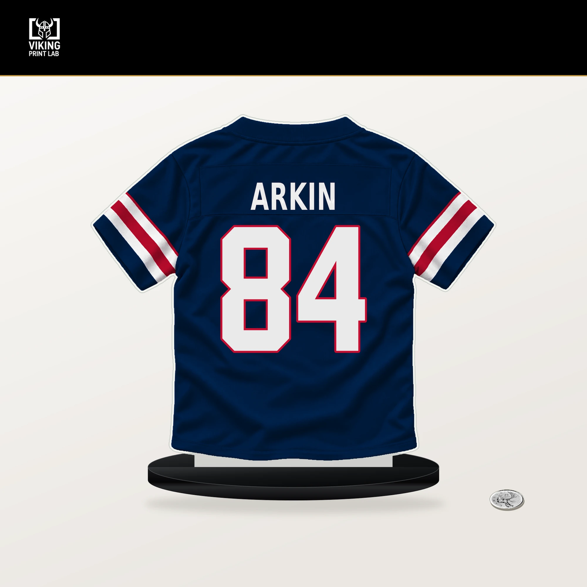 Tanner Arkin number 84 New England Patriots jersey stand with included black base.