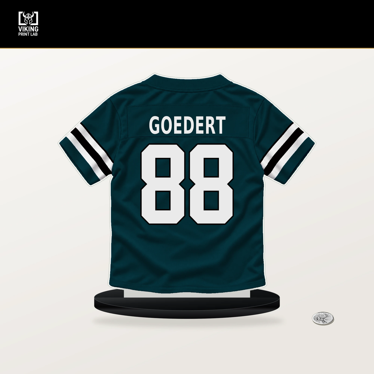 Dallas Goedert number 88 Philadelphia Eagles jersey stand with included black base.
