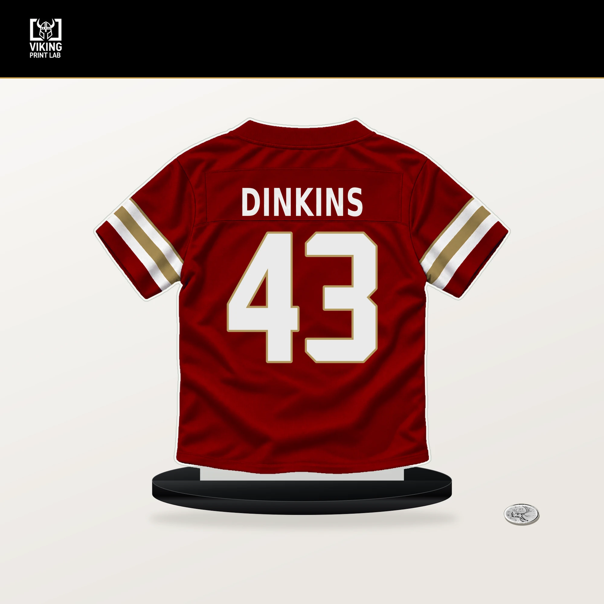 Khalil Dinkins number 43 San Francisco 49ers jersey stand with included black base.