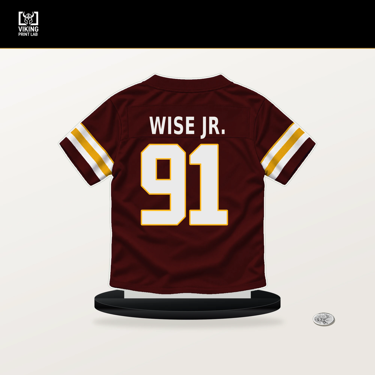 Deatrich Wise Jr. number 91 Washington Commanders jersey stand with included black base.