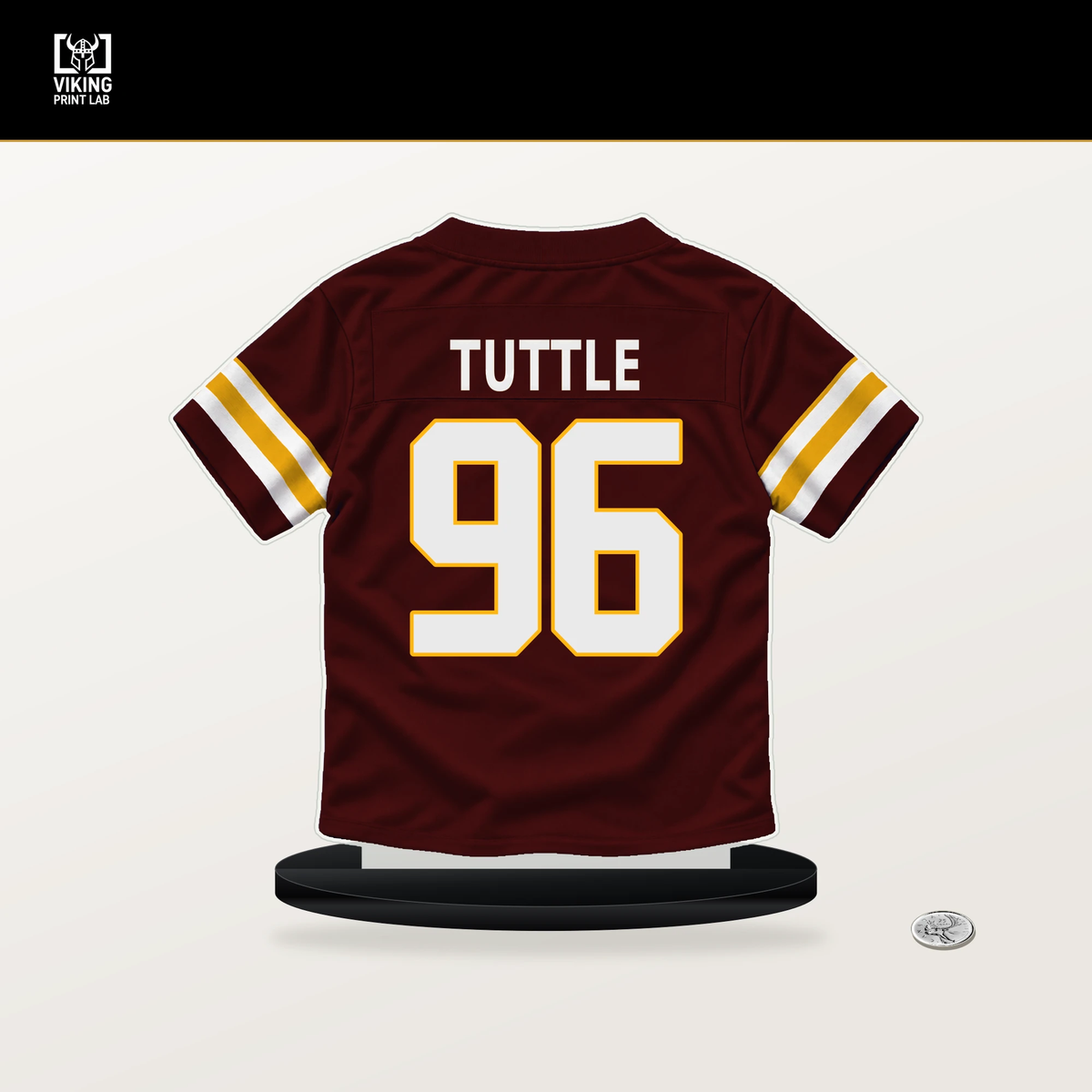 Shy Tuttle number 96 Washington Commanders jersey stand with included black base.