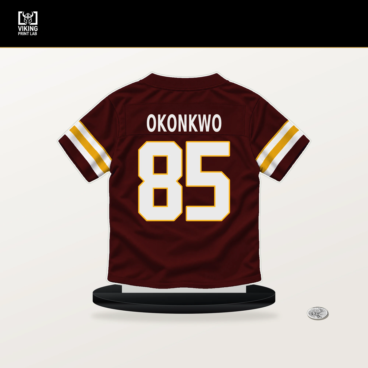 Chig Okonkwo number 85 Washington Commanders jersey stand with included black base.