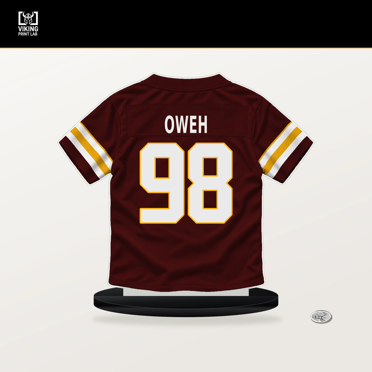 Odafe Oweh number 98 Washington Commanders jersey stand with included black base.