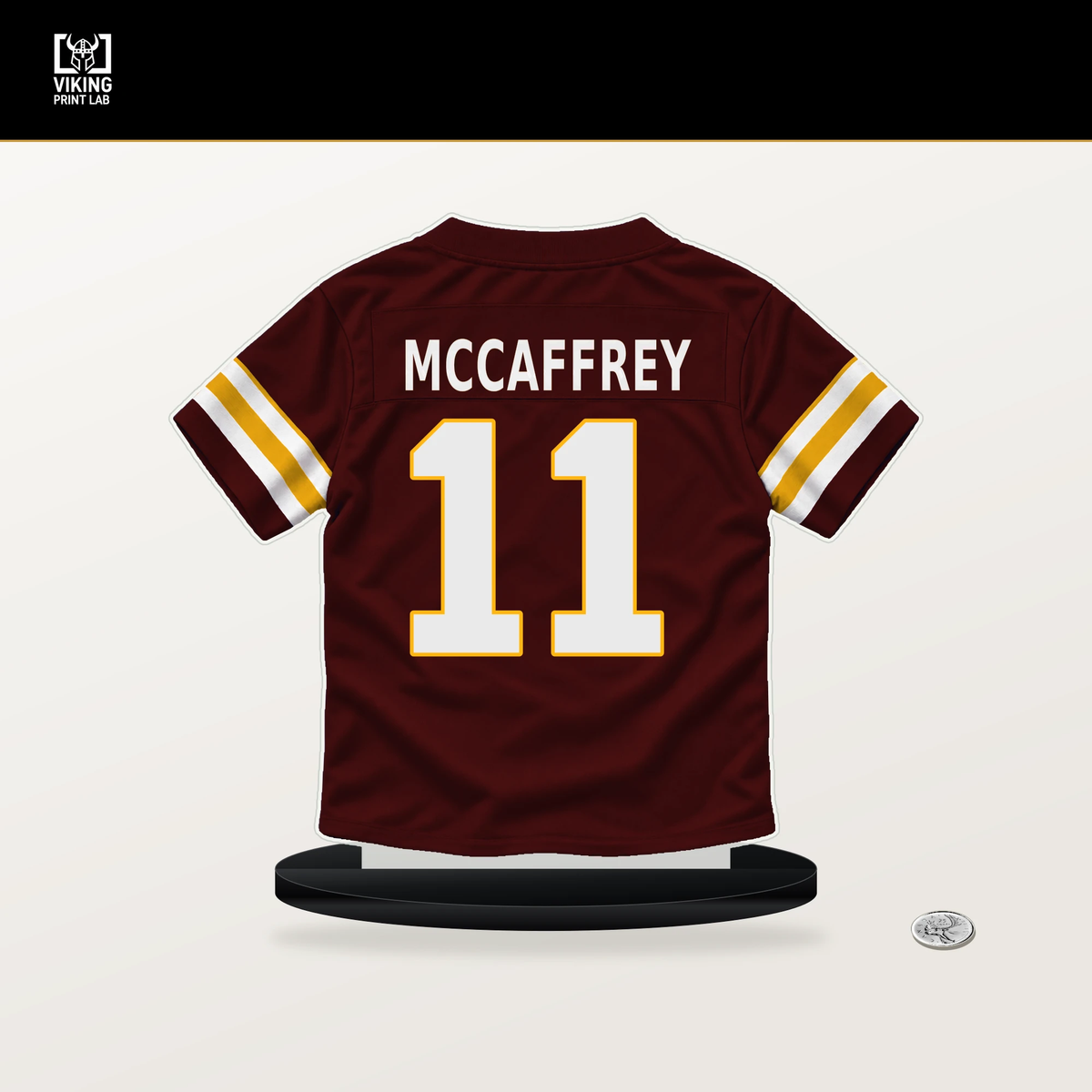 Luke McCaffrey number 11 Washington Commanders jersey stand with included black base.
