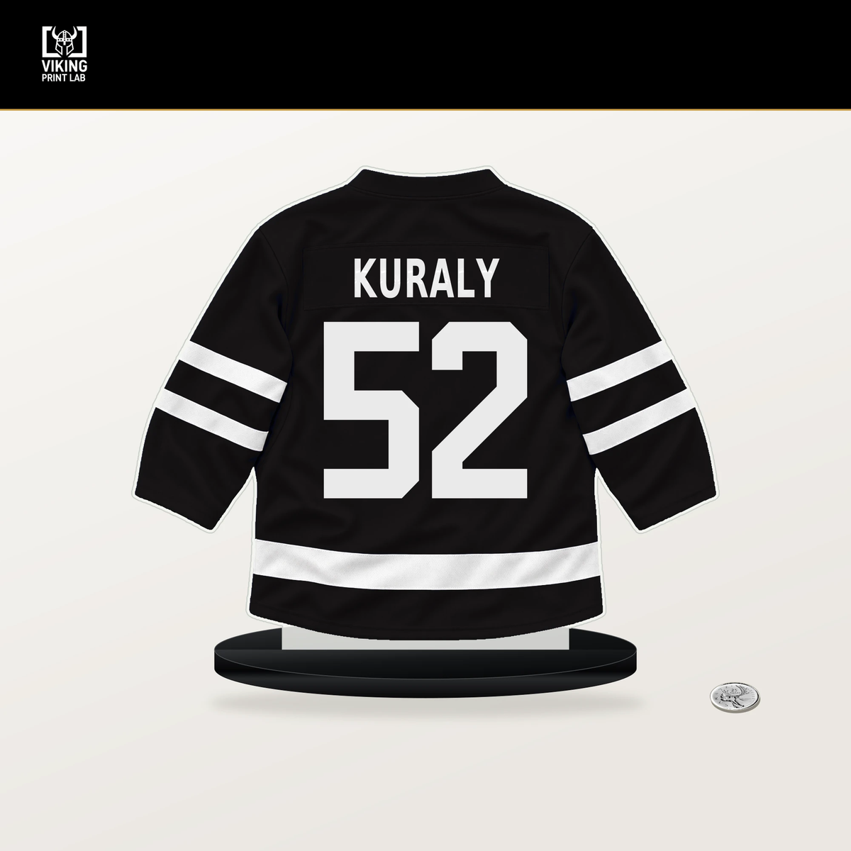 Sean Kuraly number 52 Boston Bruins jersey stand with included black base.