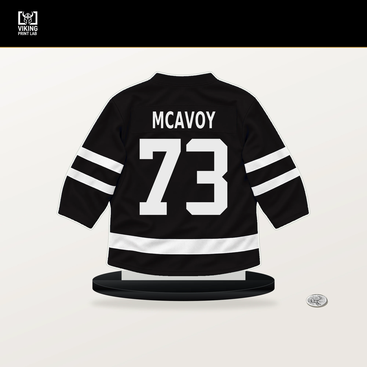 Charlie McAvoy number 73 Boston Bruins jersey stand with included black base.