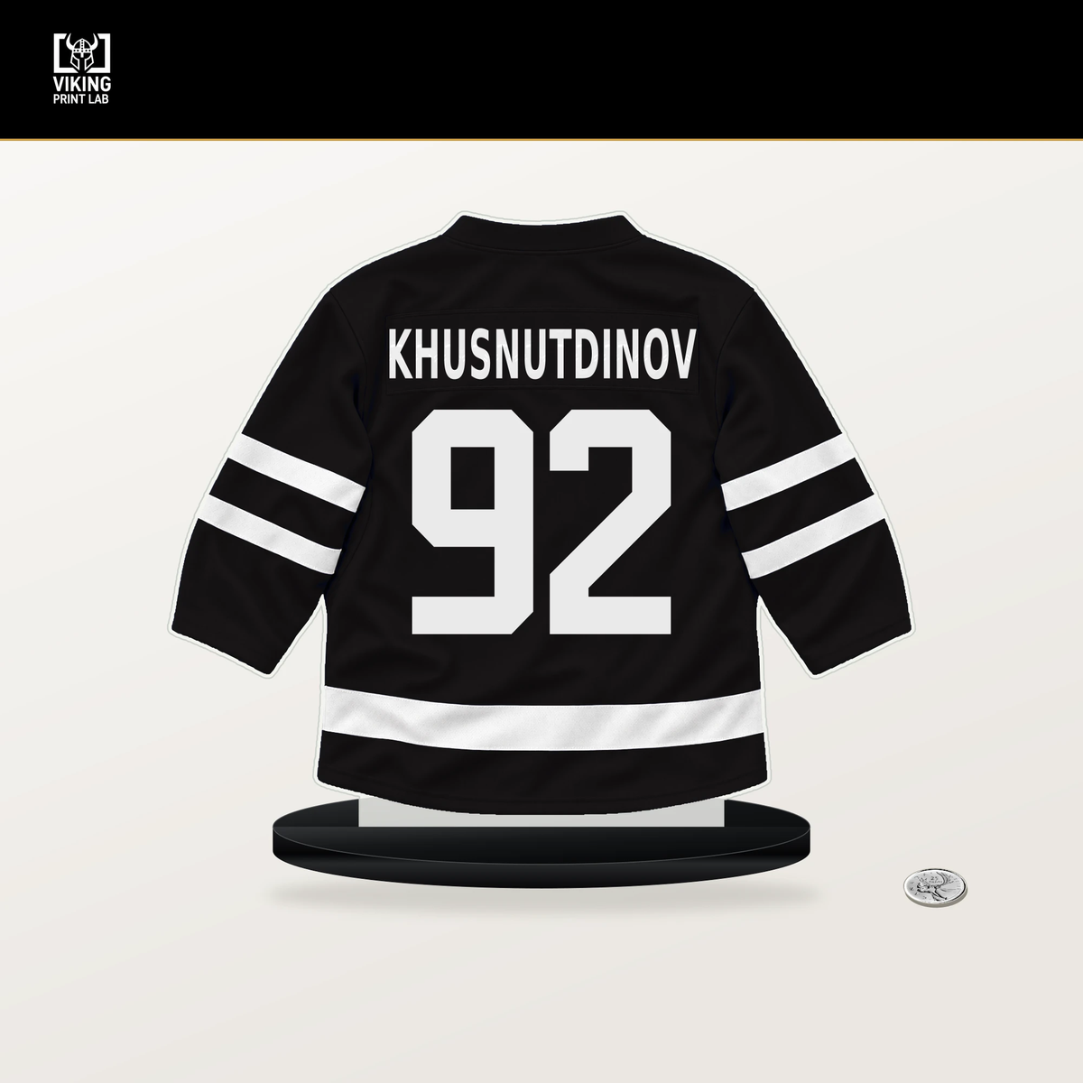 Marat Khusnutdinov number 92 Boston Bruins jersey stand with included black base.