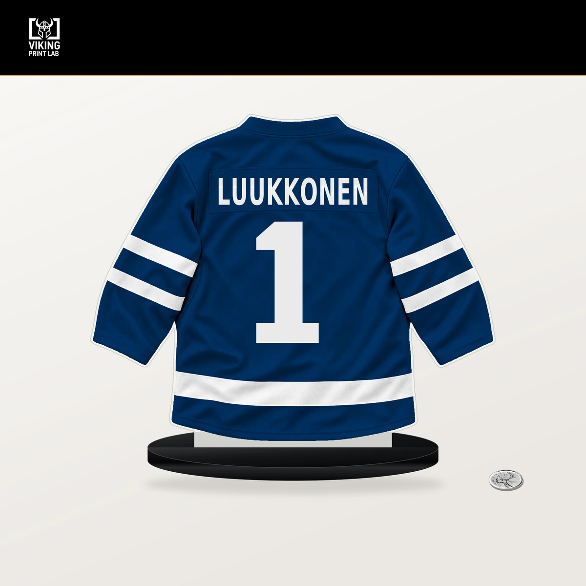Ukko-Pekka Luukkonen number 1 Buffalo Sabres jersey stand with included black base.