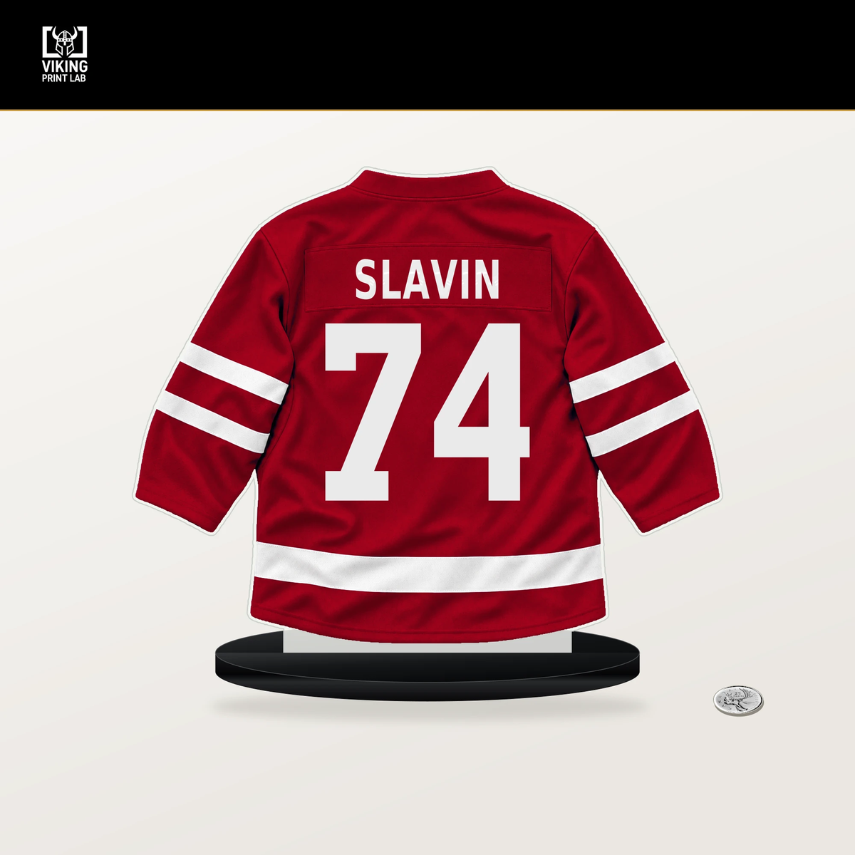 Jaccob Slavin number 74 Carolina Hurricanes jersey stand with included black base.