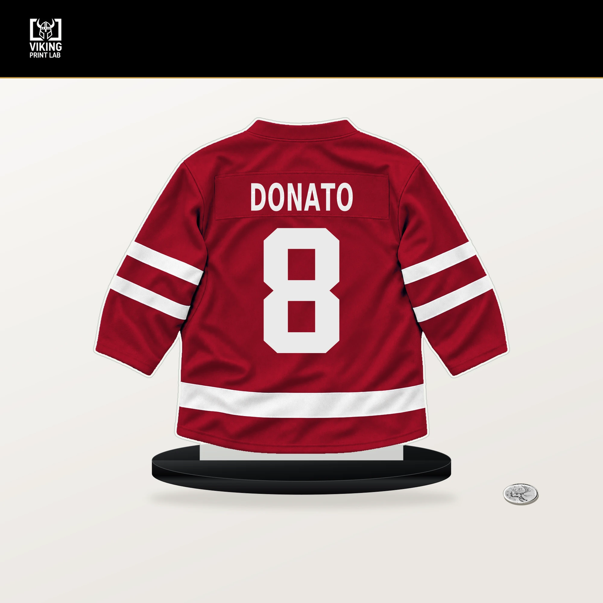 Ryan Donato number 8 Chicago Blackhawks jersey stand with included black base.