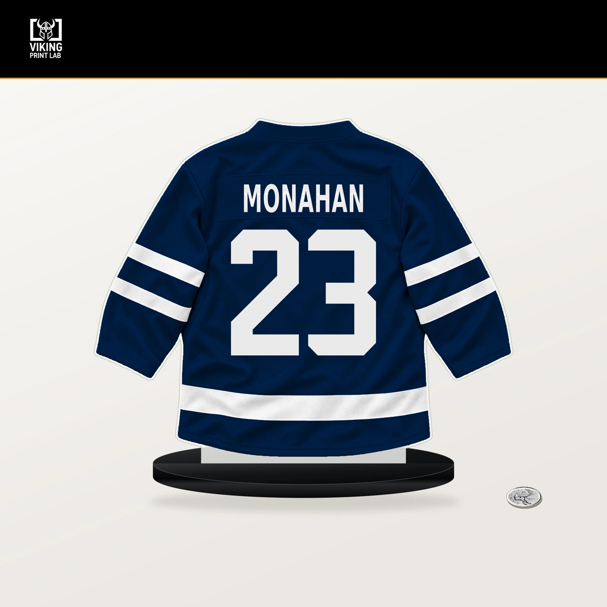 Sean Monahan number 23 Columbus Blue Jackets jersey stand with included black base.