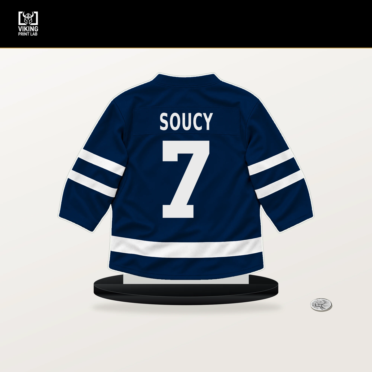 Carson Soucy number 7 Columbus Blue Jackets jersey stand with included black base.
